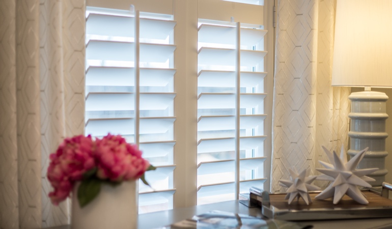 Plantation shutters by flowers in Philadelphia